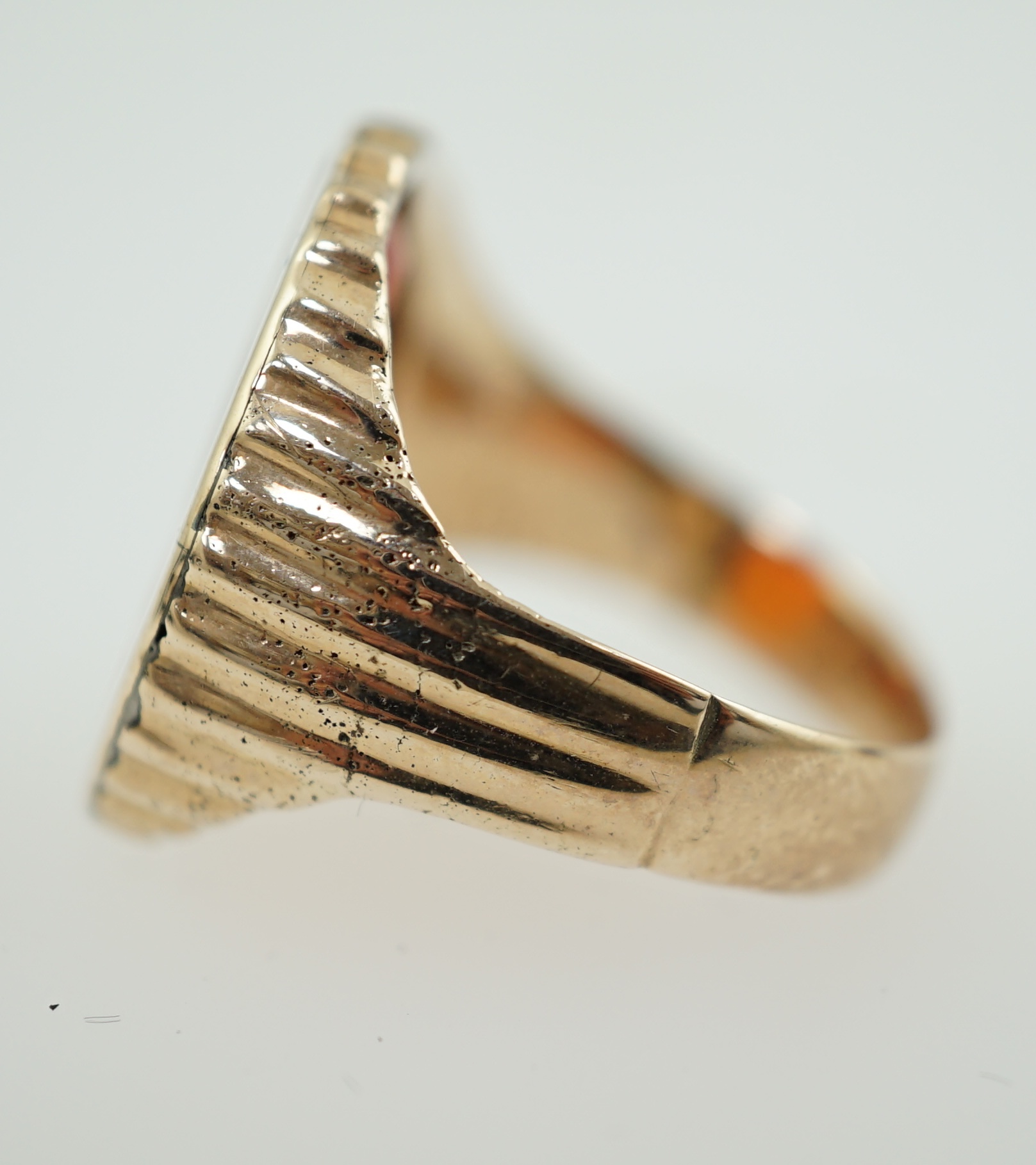 An antique Austro Hungarian gold and carnelian intaglio set oval ring, carved with the bust to dexter of Arch Duke Joseph